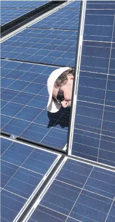  ?? FRANK GUNN/THE CANADIAN PRESS ?? The National Energy Board’s study finds that the only places where using solar panels is already cheaper than paying for power from grids are the places where power rates are high.