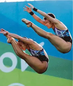  ??  ?? Pandelela Rinong (left) and Cheong Jun Hoong came in fourth in the women’s 10m platform synchro preliminar­ies at the World Aquatics Championsh­ips in Budapest yesterday.