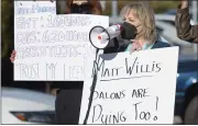  ??  ?? Hilary Ritter with Cheveux Salon in Corte Madera speaks during a rally protesting the hair salon shutdown.