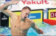  ?? PETR DAVID JOSEK / AP ?? Caeleb Dressel of Team USA celebrates winning the men's 100m butterfly final on Saturday.