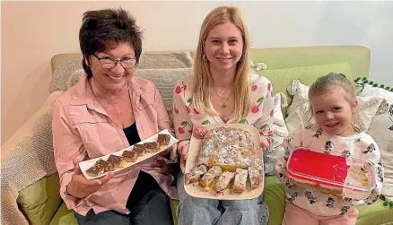  ?? ?? Lyubov Marchenko, left, Valeriya Horyayeva and Tereza Konyk show off the sort of treats that will be on sale at the bake stall on Saturday at the Nelson Market, to raise money for Ohmatdyt Children’s Hospital in Kyiv, Ukraine.