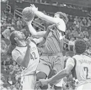  ?? Yi-Chin Lee / Houston Chronicle ?? Nene, left, contests Minnesota’s Nemanja Bjelica, but coach Mike D’Antoni said Rockets’ defense was poor.