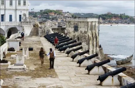  ?? CAROLYN KASTER — THE ASSOCIATED PRESS ?? First lady Melania Trump tours Cape Coast Castle with Cape Coast Castle museum educator Kwesi Essel-Blankson in Cape Coast, Ghana, Wednesday. The first lady is visiting Africa on her first solo internatio­nal trip.