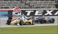  ?? TONY GUTIERREZ - THE ASSOCIATED PRESS ?? Josef Newgarden, front, Scott Dixon, rear, and Felix Rosenqvist, right, race down the front stretch during an IndyCar auto race at Texas Motor Speedway in Fort Worth, Texas, Saturday, June 6, 2020.