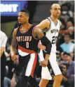  ?? Kin Man Hui / San Antonio Express-News ?? Damian Lillard walks by Manu Ginobili with purpose.