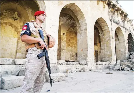  ??  ?? A Russian military police officer stands guard in the yard of Aleppo’s oldest Umayyad mosque, Syria on Sept 12. The recapture of eastern Aleppo in December 2016, one of the deadliest episodes of the Syrian civil war, was a landmark victory for Assad’s...