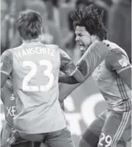  ??  ?? Seattle defender Roman Torres, right, celebrates the winning goal he made in the sudden-death round of penalty kicks in the MLS Cup soccer final against Toronto on Saturday night. Frank Gunn, The Canadian Press