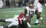  ?? JOHN BAZEMORE — THE ASSOCIATED PRESS ?? Alabama defensive back Ronnie Harrison (15) hits Florida State quarterbac­k Deondre Francois (12) during the second half Saturday. Francois suffered a season-ending injury on the play, crushing FSU’s national title hopes