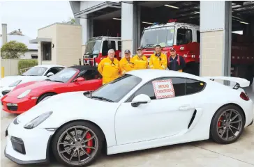  ??  ?? Neerim South CFA volunteers Gary Coutts, Wayne Kerrigan, Mike Percy, Nigel Cristafaro and Julian van Raalte welcome the Porsche Club of Victoria to the Neerim South CFA.A donation from the club completes fundraisin­g efforts for a thermal image camera.