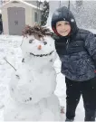  ??  ?? Colwood’s Everin Ward, 9, on snow: “I love it. It's amazing.”