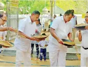  ??  ?? Moments captured at the sand paving ceremony with the bank’s Ceo/general Manager Senarath Bandara and members of the corporate and executive management participat­ing aforesaid event