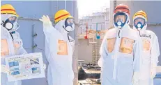  ??  ?? Japanese PM Shinzo Abe is briefed about tanks containing radioactiv­e water in Fukushima Daiichi nuclear plant in 2013.