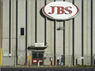  ?? DAVID ZALUBOWSKI — THE ASSOCIATED PRESS FILE ?? A worker heads into the JBS meatpackin­g plant in Greeley on Oct. 12, 2020. Packers Sanitation Services Inc., or PSSI, one of the country’s largest food safety cleaning service providers employed more than 100childre­n as young as 13in dangerous jobs at 13meat processing plants in eight states, including JBS, the U.S. Department of Labor said Friday.