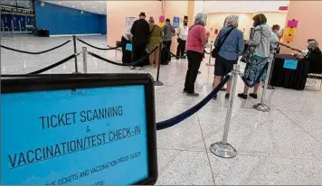  ?? Lori Van Buren / Times Union ?? Employees scan tickets and check proof of vaccine/negative test before a Sept. 9 show in The Egg at the Empire State Plaza in Albany.