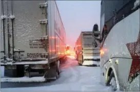  ?? ASSOCIATED PRESS ?? In this photo provided by Dave Saba, traffic is at a standstill on the Pennsylvan­ia Turnpike near Somerset, Pa., Saturday, Jan. 23, 2016. The Duquesne men’s basketball team and Temple University’s women’s gymnastics team are stuck on the Turnpike due to a treacherou­s weather conditions. A mammoth winter storm crawled up the U.S. East Coast Saturday, making roads impassable, shutting down mass transit, and bringing Washington and New York City to a standstill.
