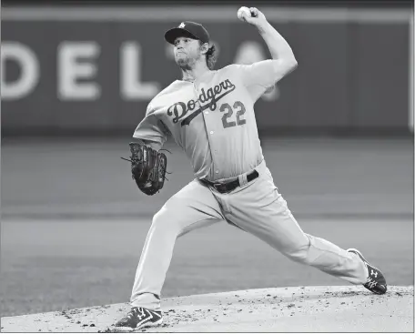  ?? FRANK FRANKLIN II/AP PHOTO ?? Clayton Kershaw delivers a pitch during the Los Angeles Dodgers’ 3-0 victory over the New York Mets on Thursday night at Citi Field. Kershaw pitched a three-hitter after retiring the first 18 Mets hitters.