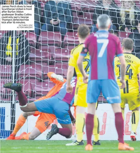  ?? PICTURES: EPIC ACTION IMAGERY. PICS: EPIC ACTION IMAGERY ?? James Perch dives to head Scunthorpe United in front after Burton Albion goalkeeper Bradley Collins could only parry George Thomas’s deflected free kick after 16 minutes.