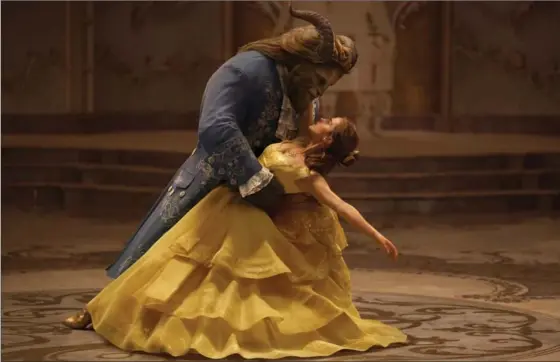  ?? THE ASSOCIATED PRESS ?? Dan Stevens as The Beast and Emma Watson as Belle in a live-action adaptation of “Beauty and the Beast.”