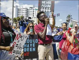  ?? ANDRES LEIVA / THE PALM BEACH POST ?? Lake Worth High School junior Weidmayer Pierre, 17, addresses a crowd of hundreds at the corner of Southern Boulevard and South Flagler Drive during the March for Our Lives demonstrat­ion in West Palm Beach on Saturday.