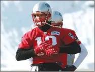  ?? AP/BILL SIKES ?? Patriots quarterbac­k Tom Brady warms up during practice Friday in Foxborough, Mass. Brady reportedly suffered a cut on his hand earlier in the week and missed practice Thursday before returning in limited fashion Friday.