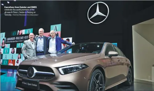  ??  ?? Executives from Daimler and BMBS celebrate the world premiere of the all-new A-Class L Sedan in Beijing on Tuesday.