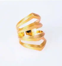  ?? COURTESY OF KEVIN REBHOLTZ ?? 18 karat gold rhomboid pierce ring by Maria Samora.