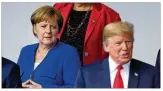  ?? SEAN GALLUP / GETTY IMAGES ?? German Chancellor Angela Merkel and U.S. President Donald Trump attend the NATO Summit in Brussels.