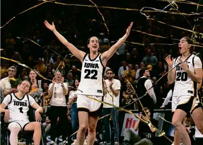  ?? MATTHEW HOLST/GETTY IMAGES ?? A historic day for Caitlin Clark (22) included senior day festivitie­s following Iowa’s win.