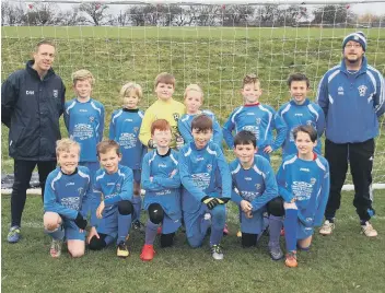  ??  ?? Heslerton Under-11s line-up before their game against Scholes Park on Sunday