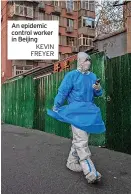  ?? KEVIN FREYER ?? An epidemic control worker in Beijing