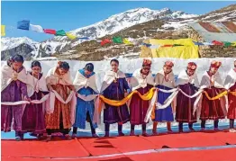  ?? — PTI ?? Tribal community women perform during the ongoing snow festival at Gondhla village in Lahaul-Spiti on Thursday.