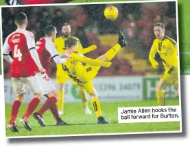  ??  ?? Jamie Allen hooks the ball forward for Burton.