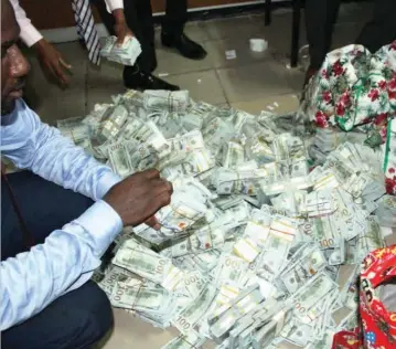  ?? PHOTO: EFCC ?? Large sums of foreign currency and naira notes found at House 16, Osborne Road, Ikoyi in Lagos