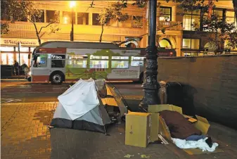  ?? Guy Wathen / The Chronicle ?? A tent is set up on the 800 block of Market Street in San Francisco, outside an entrance to a BART station. The homeless count has soared in the city, rising 30 percent in two years.