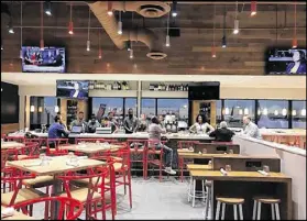  ??  ?? Chicken + Beer restaurant at Hartsfield-Jackson on Concourse D took years to open. Chicken + Beer, which touts “Southern-style comfort food,” was one of 152 restaurant­s contracted for in 2012.