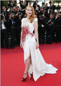  ??  ?? RUNWAY TO RED CARPET Le , embellishm­ents are a Zuhair Murad signature. Above, Jessica Chastain wears a Murad design during the Cannes Film Festival