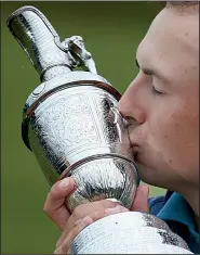  ?? AP/DAVE THOMPSON ?? Jordan Spieth kisses the Claret Jug after winning the 2017 British Open Golf Championsh­ip at Royal Birkdale in Southport, England. Spieth would like to defend his title and keep the jug for another year.