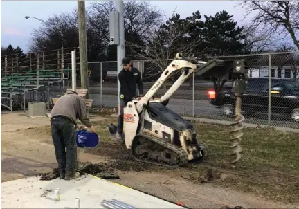  ?? COURTESY MARK SACKETT ?? Constructi­on workers put in new dugouts earlier this month at a Memorial Park baseball field in Royal Oak for the city’s first collegiate team, the Royal Oak Leprechaun­s. Funding and COVID-19have delayed constructi­on and the team’s first season until 2021.