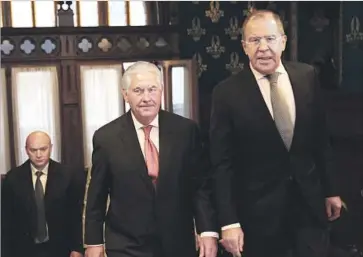  ?? Glen Johnson Planet Pix ?? U.S. SECRETARY OF STATE Rex Tillerson, center, and Russian Foreign Minister Sergei Lavrov, right, appeared unhappy with each other but said they saw ways to salvage relations between the nuclear powers.