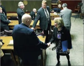  ?? RECORD FILE PHOTO ?? Rensselaer County Executive Kathy Jimino shakes hands with county Legislator Lester Goodermote after delivering her State of the County address March 11, 2014.