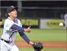  ?? Jeremy Stewart / Rome News-Tribune ?? Rome pitcher Alan Rangel tosses to ball toward first base for an out during the fourth inning of the Braves’ game against the Augusta GreenJacke­ts.