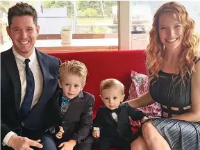  ??  ?? Close family: Michael Buble with wife Luisana and sons Noah and Elias