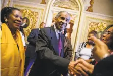  ?? Andrew Harnik / Associated Press ?? Loretta Lynch’s father, Lorenzo Lynch, greets supporter at the Capitol, accompanie­d by Rep. Sheila Jackson Lee, D- Texas.