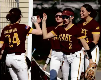  ?? MARK STOCKWELL FOR THE GLOBE ?? Junior captain Skye Dupre (center), hitting .579, is a key to Joseph Case’s success.