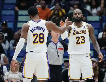  ?? AP PHOTO/GERALD HERBERT ?? Los Angeles Lakers forward Lebron James (23) celebrates with forward Rui Hachimura (28) after being fouled in the second half of an NBA basketball game against the New Orleans Pelicans in New Orleans, Sunday, April 14, 2024. The Lakers won 124-108.