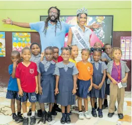  ?? PHOTOS BY GLADSTONE TAYLOR/MULTIMEDIA PHOTO EDITOR ?? After a successful session with the kindergart­en students of Maverley Primary and Infant School, Uncle Dan and Miss Jamaica World 2022 Shanique Singh were happy to accomplish the day’s goal.