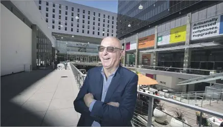  ?? Photograph­s by Brian van der Brug Los Angeles Times ?? THE AMBITIOUS makeover of the Bloc from a bunker-like indoor mall into an open outdoor center ran substantia­lly over budget and a year and a half behind schedule. Ratkovich Co. President Wayne Ratkovich, above, says the project is finally coming...