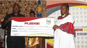  ?? Photo: MICT ?? Hand up… Education minister Anna Nghipondok­a accepting a pledge from Mbashi Fishing.