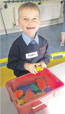  ??  ?? Growing boy: Freddie while he was undergoing treatment when he was a baby – and now the “happiest little man” school at