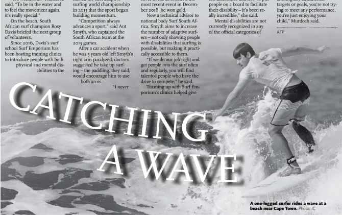  ?? Photo: IC ?? A one-legged surfer rides a wave at a beach near Cape Town.
